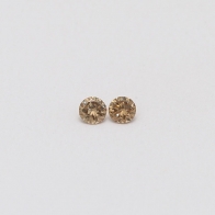 0.10 Total carat pair of champagne diamonds